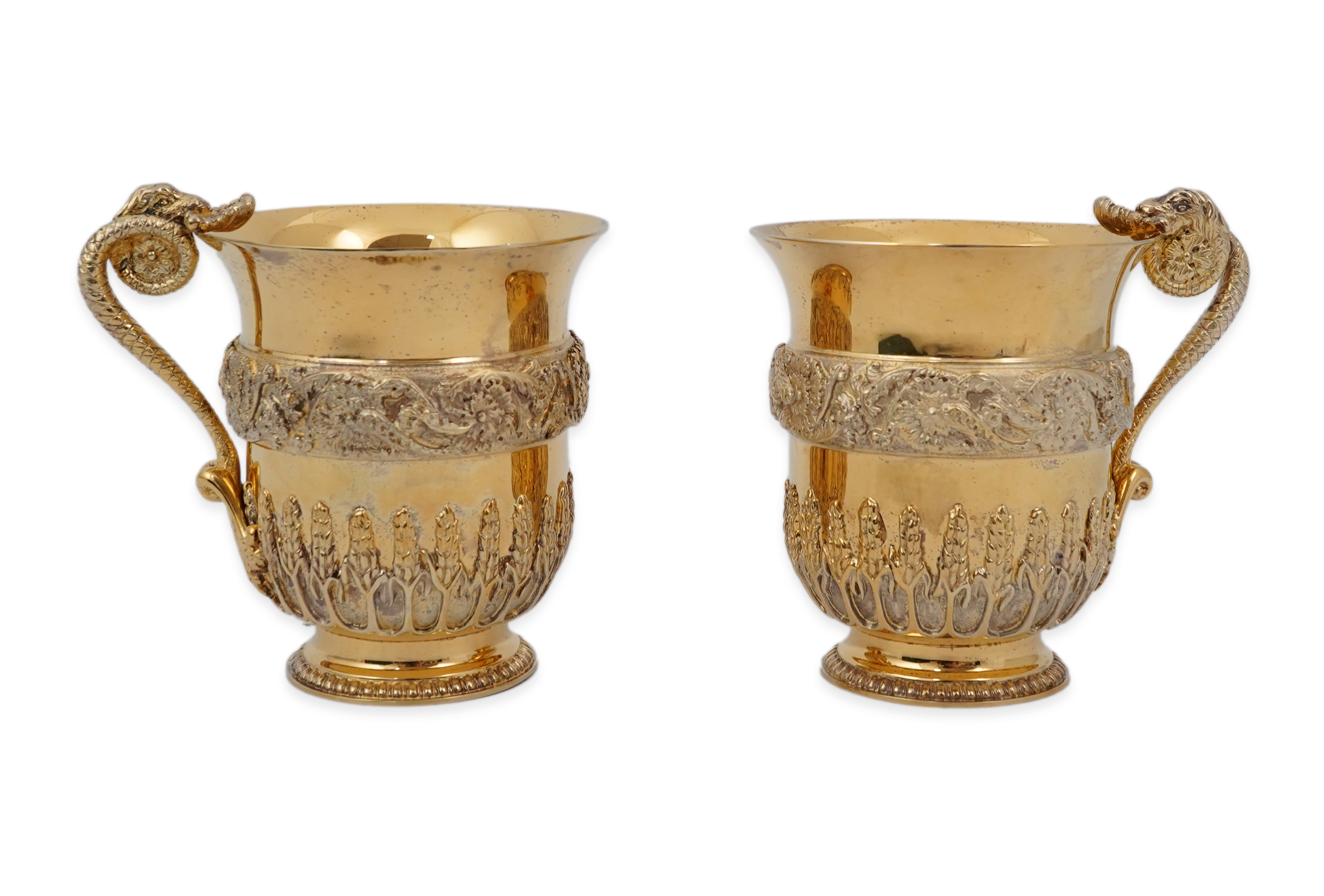 An ornate pair of Elizabeth II silver gilt cups, by Richard O.A. Jarvis